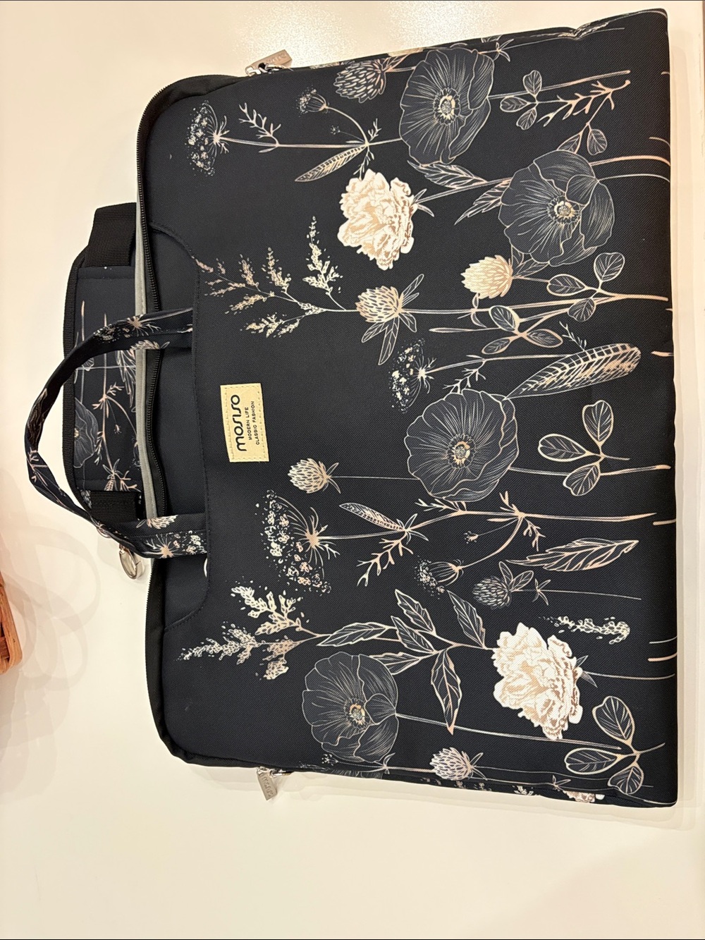 Mosiso brand Black Floral Laptop Bag with Cream Accents